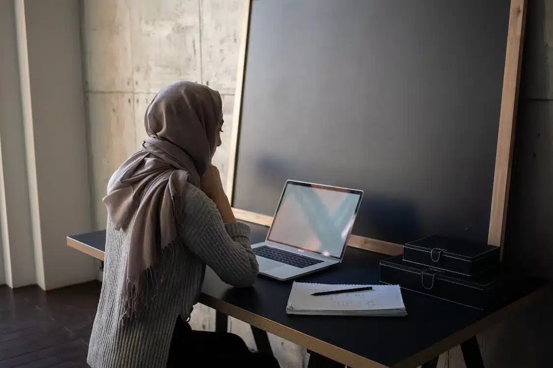 Woman browsing on her laptop